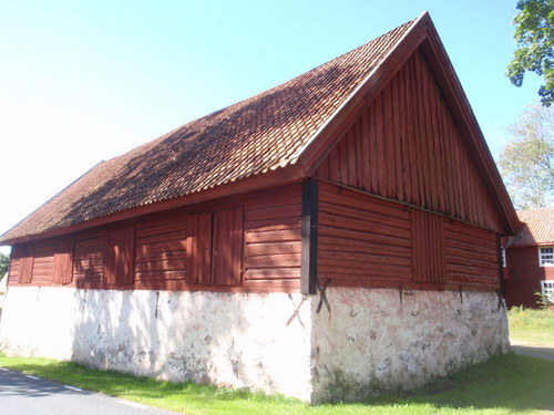 Old Barn on a Stone Wall.